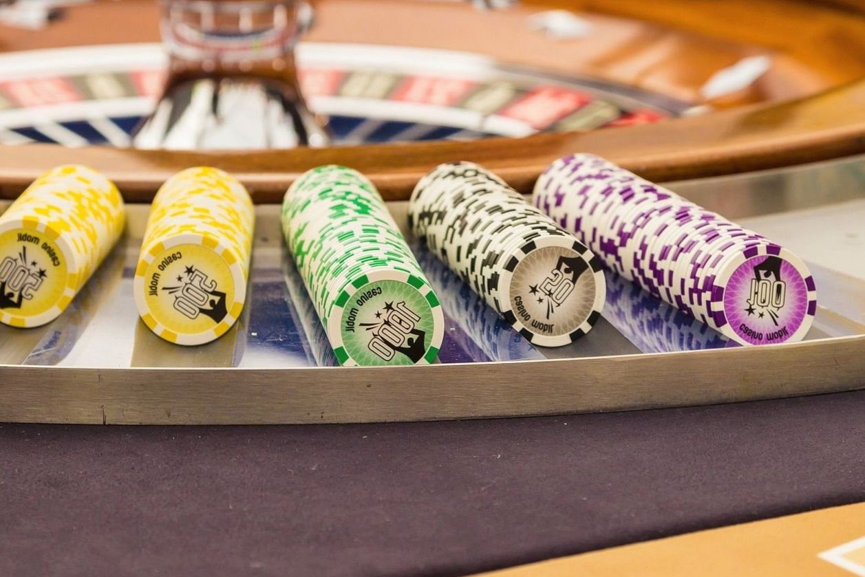 Poker chips and cards on table at Dreamadventureau